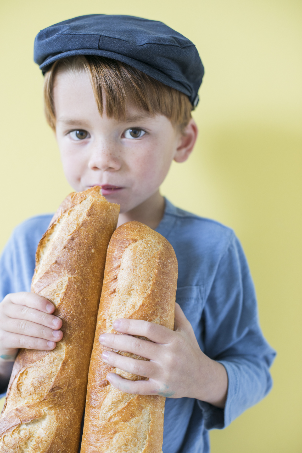 Child Eating a Baguette